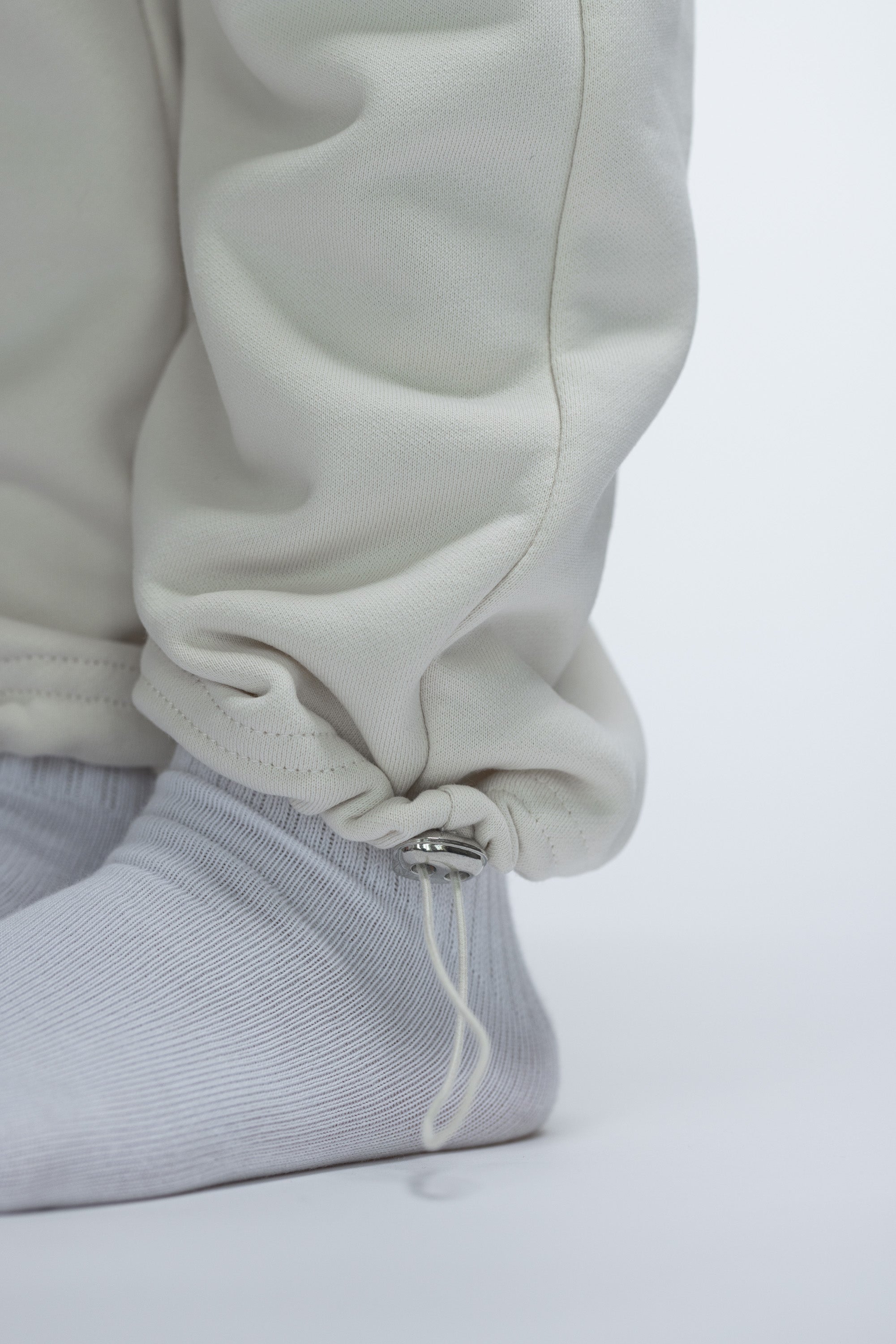 PANTALON JOGGING À LIENS DE SERRAGE ET OURLET AJUSTABLE